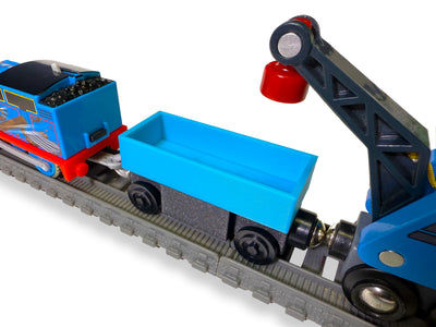 TrainLab TrackWay Car connecting a TrackMaster train to wooden railway cars