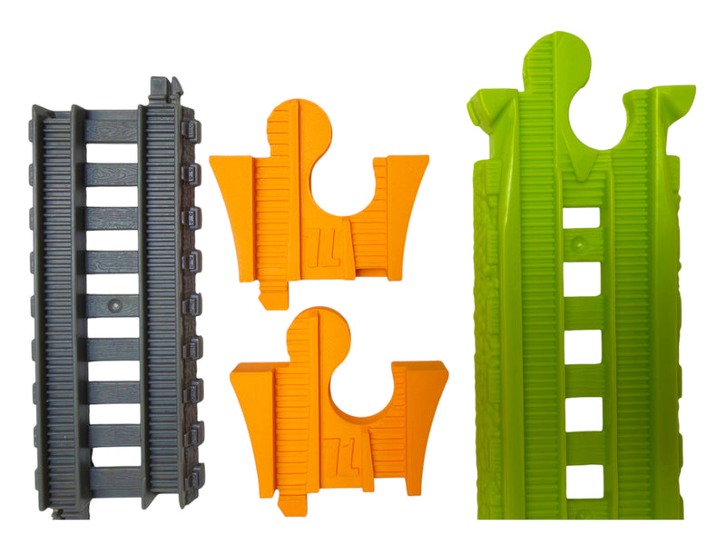 Two orange TrainLab adapters beside gray TrackMaster and Easy Connect track