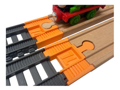 Orange TrainLab adapter pair joining gray TrackMaster 2014 track to wooden railway track