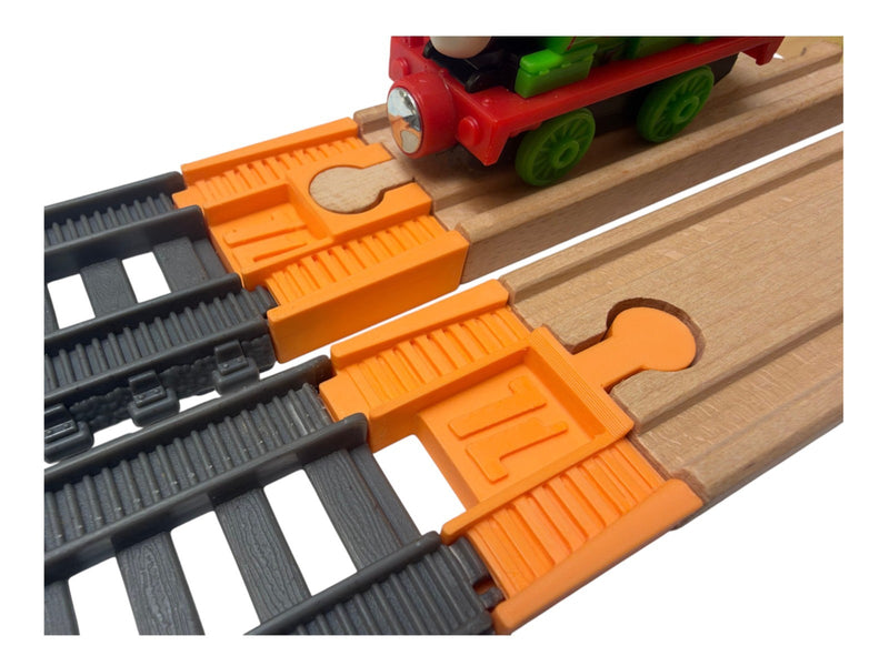 Orange TrainLab adapter pair joining gray TrackMaster 2014 track to wooden railway track